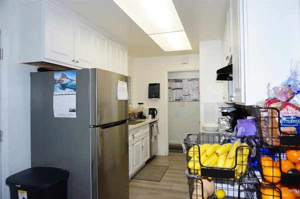 a kitchen with stainless steel appliances refrigerator and stove