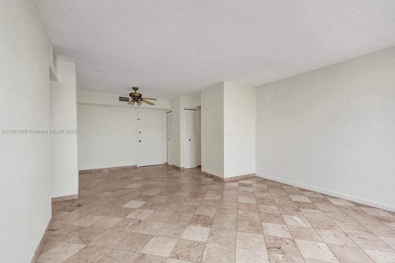 2025 Northeast 164th Street, Unit 716 North Miami Beach, FL 33162 - Photo 11 of 39 a view of an empty room