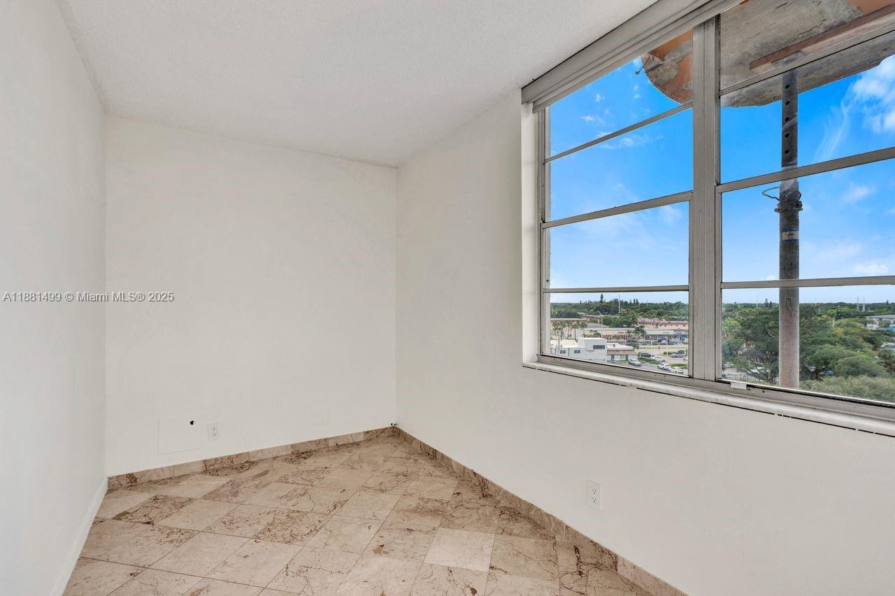 2025 Northeast 164th Street, Unit 716 North Miami Beach, FL 33162 - Photo 13 of 39 a view of empty room with a window