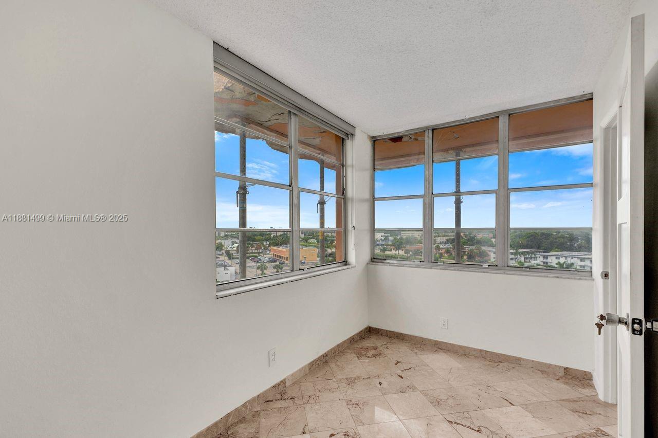2025 Northeast 164th Street, Unit 716 North Miami Beach, FL 33162 - Photo 17 of 39 a view of an empty room with a window