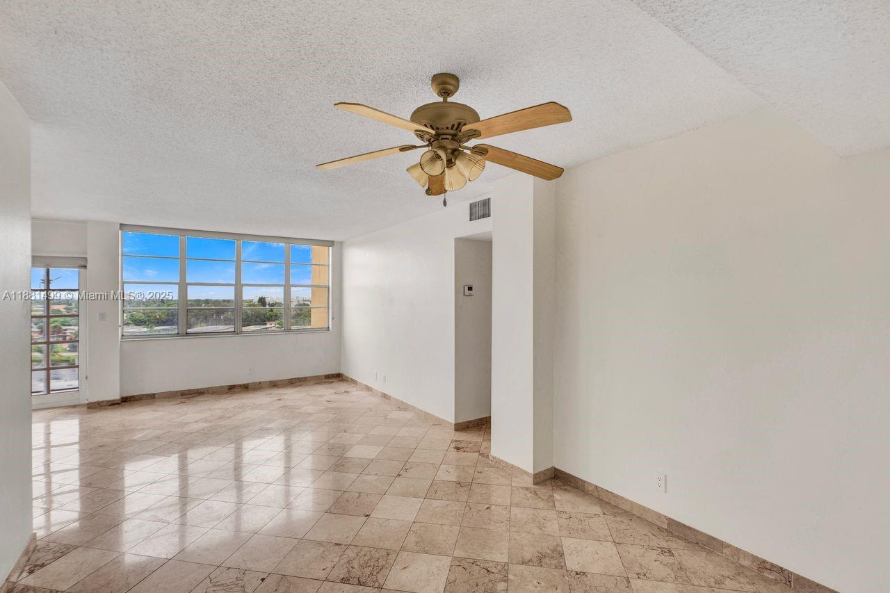 2025 Northeast 164th Street, Unit 716 North Miami Beach, FL 33162 - Photo 18 of 39 a view of a kitchen with a sink and cabinet