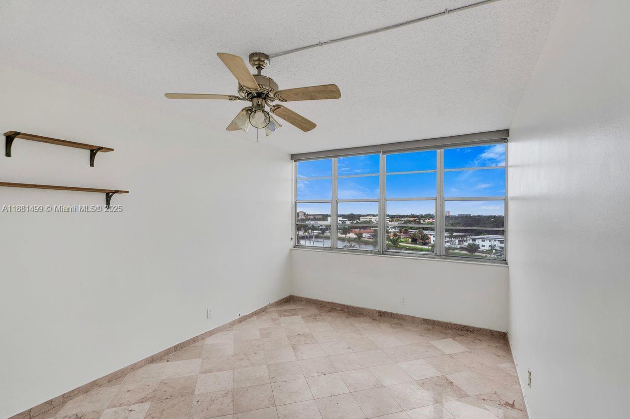 2025 Northeast 164th Street, Unit 716 North Miami Beach, FL 33162 - Photo 21 of 39 a view of a kitchen with a sink and a stove