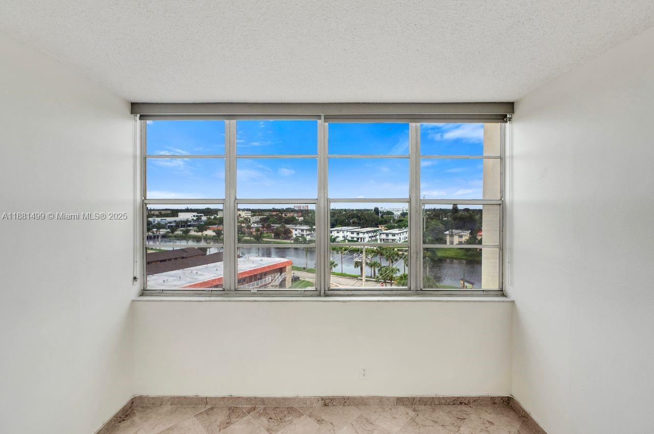 2025 Northeast 164th Street, Unit 716 North Miami Beach, FL 33162 - Photo 24 of 39 a view of a living room with a large window