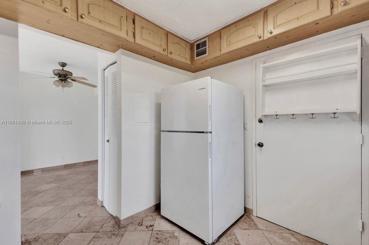 2025 Northeast 164th Street, Unit 716 North Miami Beach, FL 33162 - Photo 5 of 39 a view of a hallway with closet