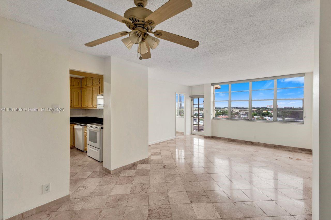 2025 Northeast 164th Street, Unit 716 North Miami Beach, FL 33162 - Photo 6 of 39 a view of a kitchen with a sink and cabinet