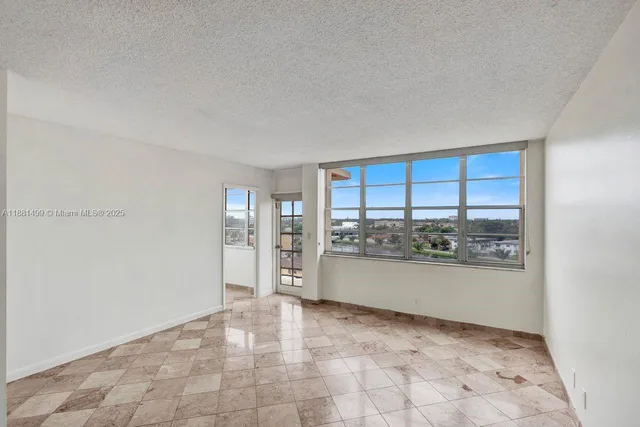 a view of a kitchen with a sink and a window