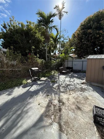 a view of a backyard with sitting area