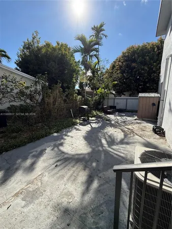 a view of backyard with sitting area