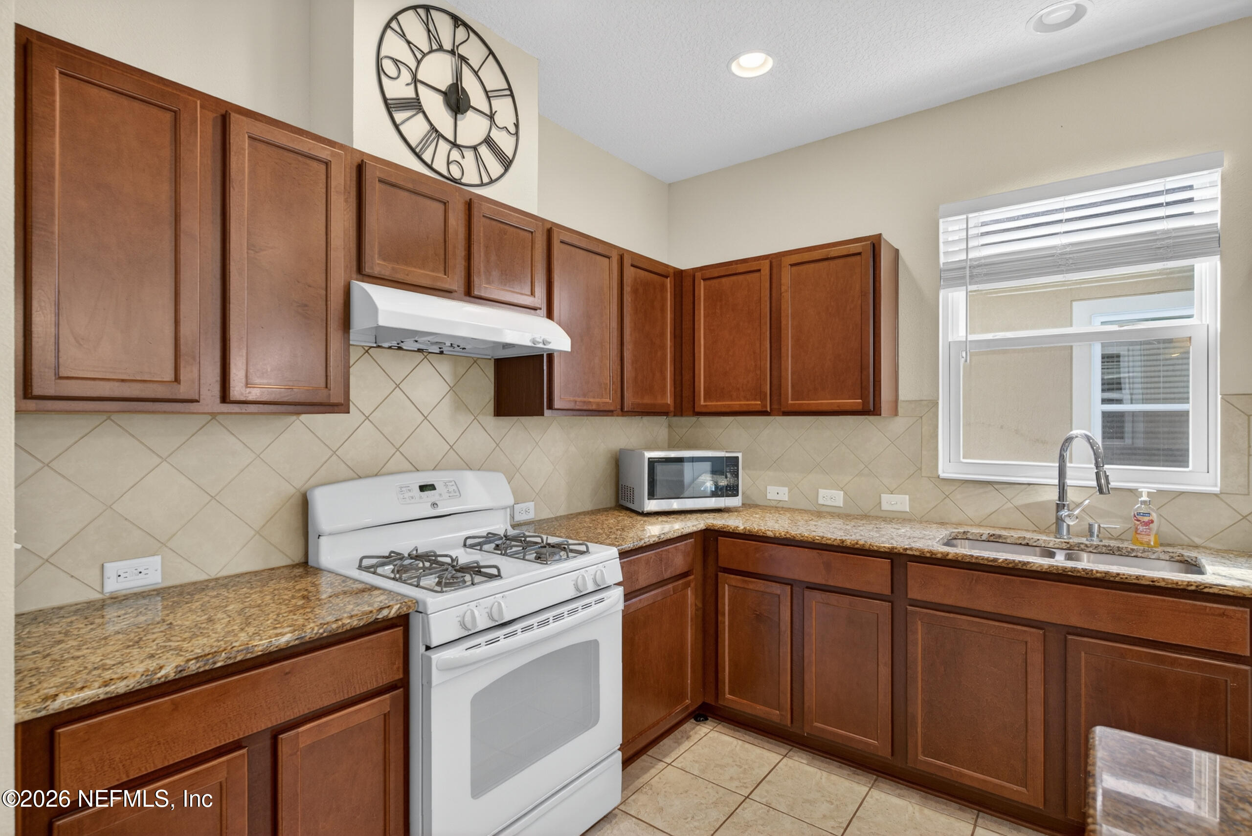 234 Taylor Ridge Avenue Ponte Vedra, FL 32081 - Photo 11 of 27 a kitchen with stainless steel appliances granite countertop a sink stove and cabinets