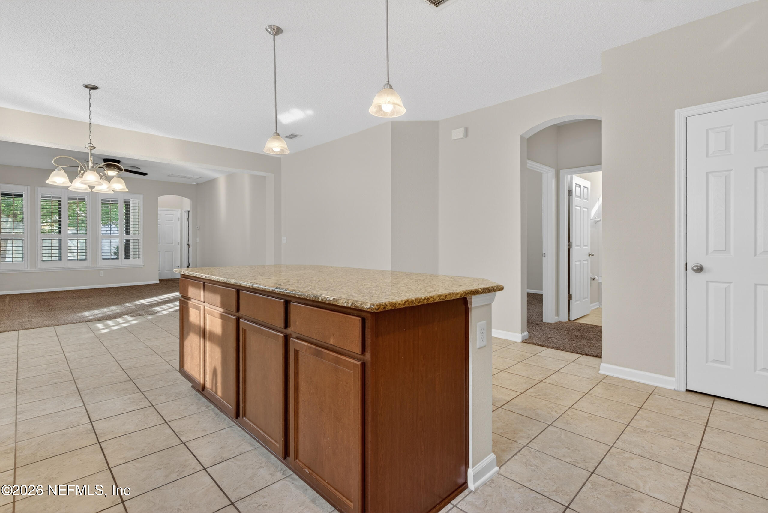 234 Taylor Ridge Avenue Ponte Vedra, FL 32081 - Photo 12 of 27 a kitchen with granite countertop a sink a counter space and cabinets