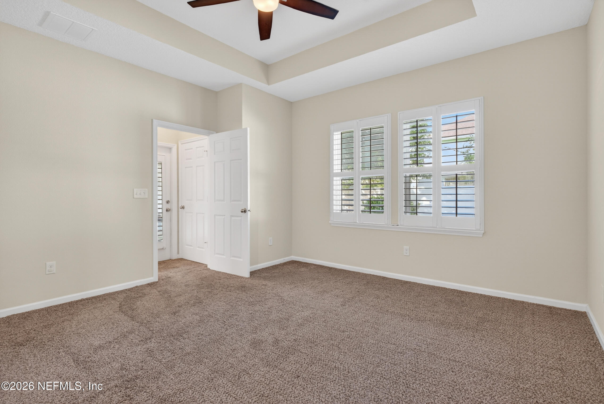 234 Taylor Ridge Avenue Ponte Vedra, FL 32081 - Photo 13 of 27 an empty room with ceiling fan and windows