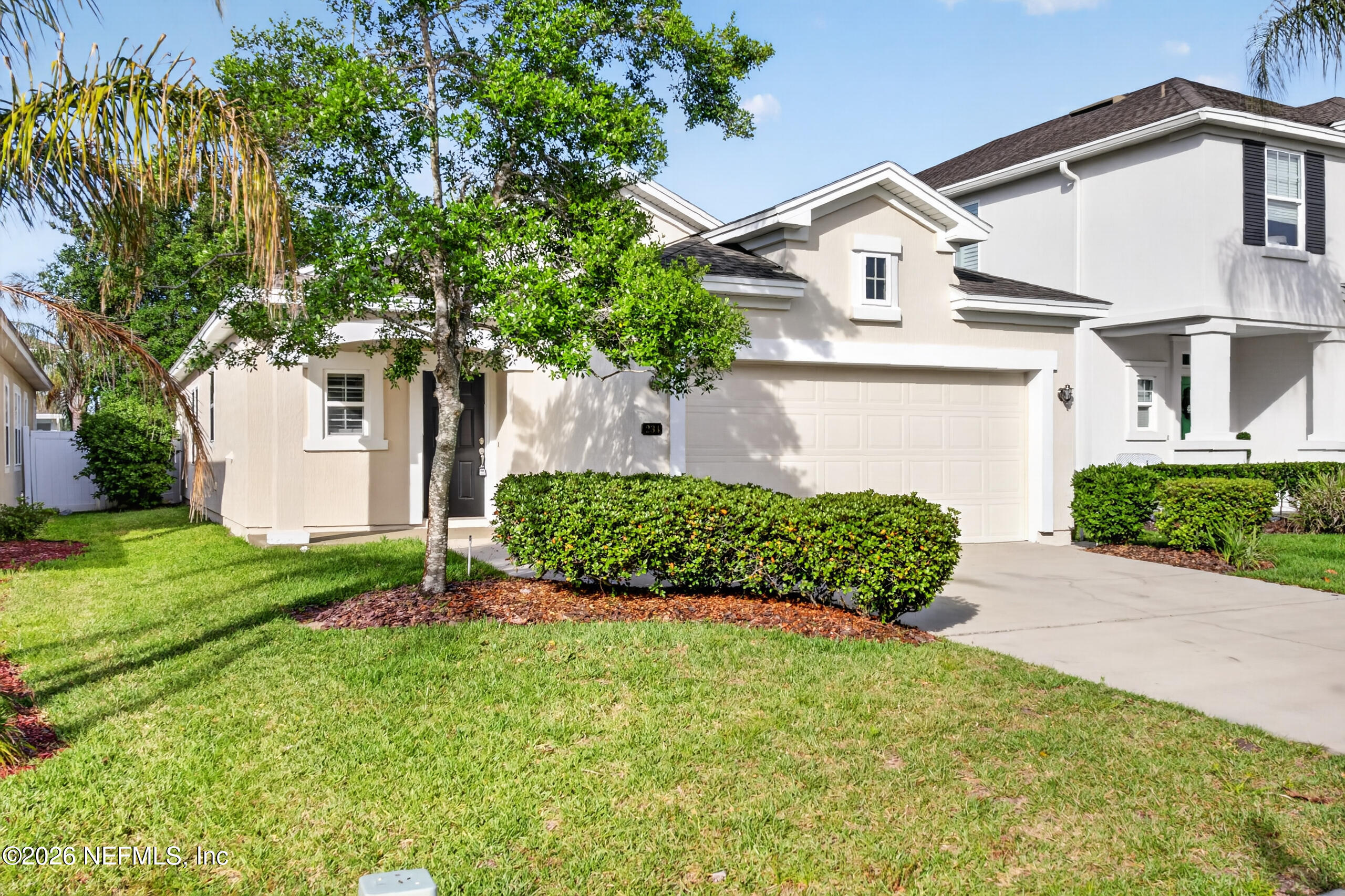 234 Taylor Ridge Avenue Ponte Vedra, FL 32081 - Photo 2 of 27 a front view of a house with a garden