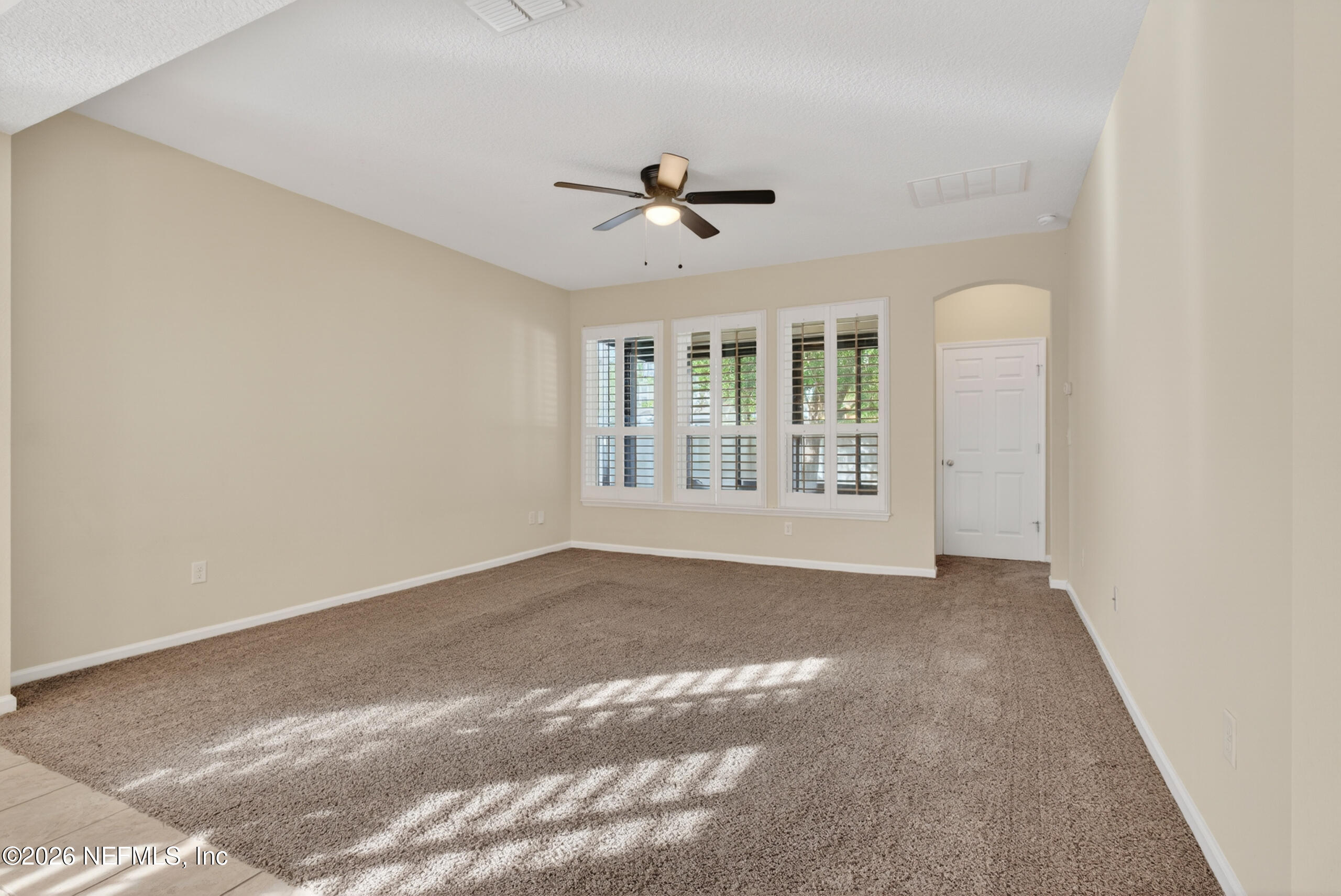 234 Taylor Ridge Avenue Ponte Vedra, FL 32081 - Photo 5 of 27 an empty room with windows and ceiling fan