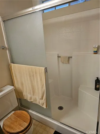 a view of a bathroom from a hallway