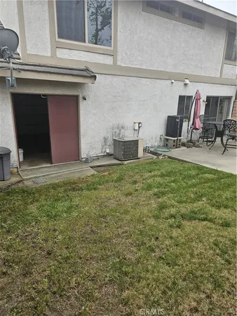 a view of backyard with hardwood and lake view