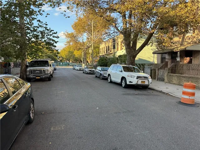 a view of street with parked cars