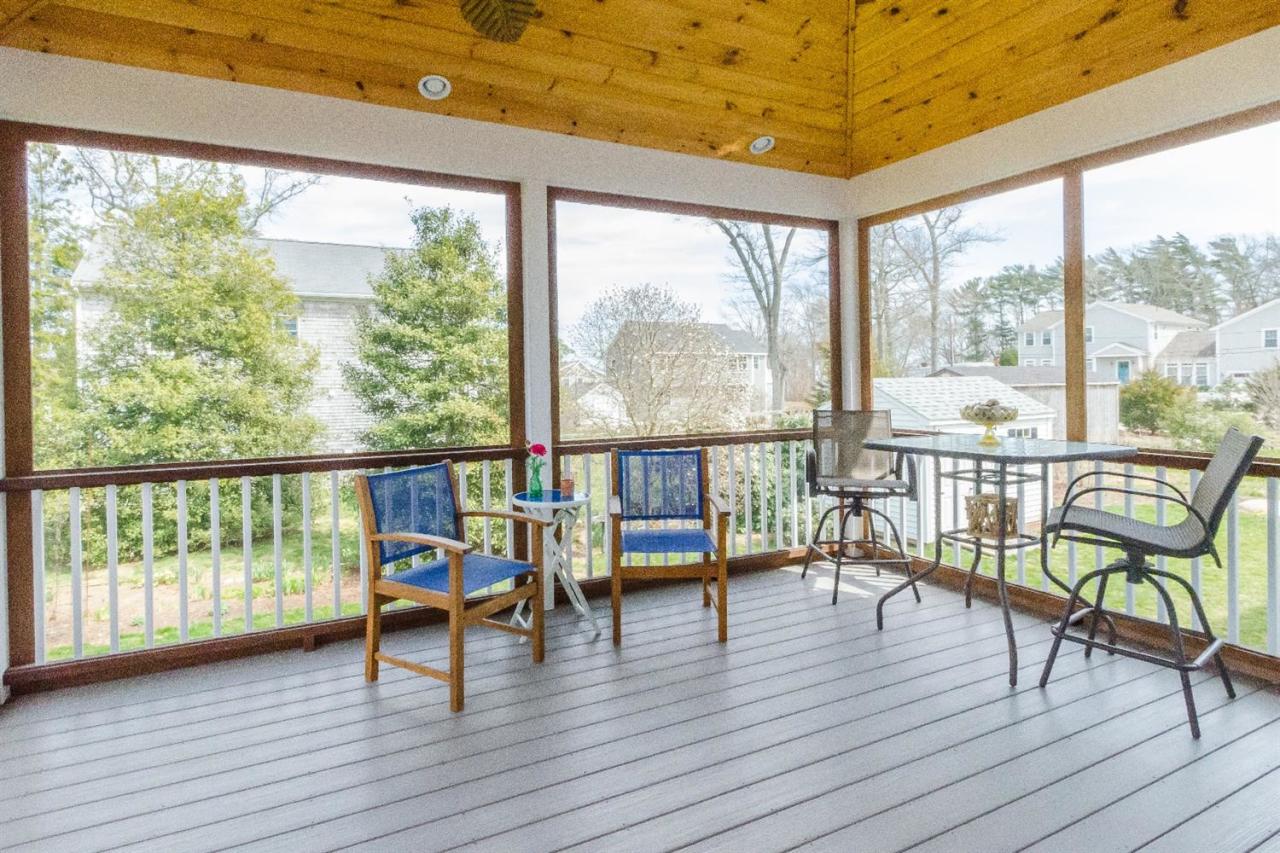 43 Converse Road Marion, MA 02738 - Photo 9 of 24 a view of a city from a balcony with furniture