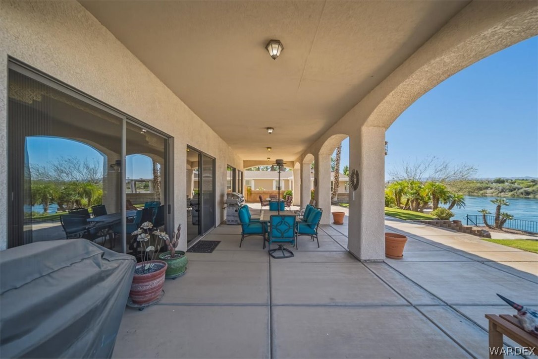 1084 Dike Road Mohave Valley, AZ 86440 - Photo 36 of 75 Expansive covered patio featuring multiple archways and concrete flooring