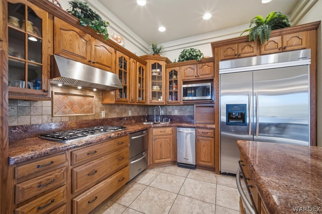 1084 Dike Road Mohave Valley, AZ 86440 - Photo 45 of 75 a kitchen with stainless steel appliances granite countertop a stove and a refrigerator