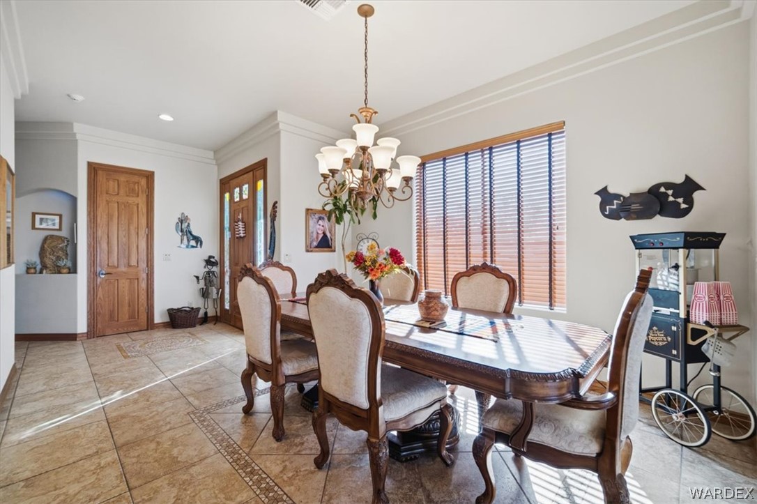 1084 Dike Road Mohave Valley, AZ 86440 - Photo 47 of 75 a dining room with furniture and window