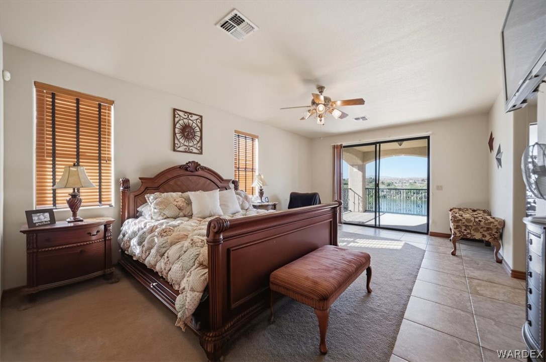 1084 Dike Road Mohave Valley, AZ 86440 - Photo 58 of 75 a spacious bedroom with a bed and a couch