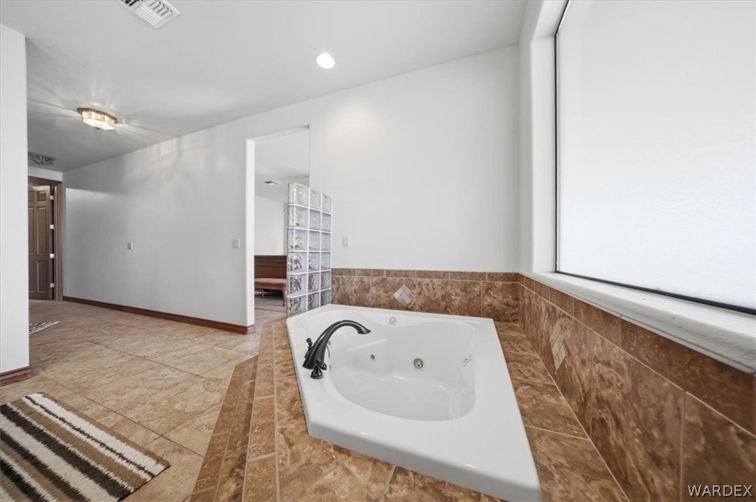 1084 Dike Road Mohave Valley, AZ 86440 - Photo 60 of 75 a bathroom with a bathtub and shower