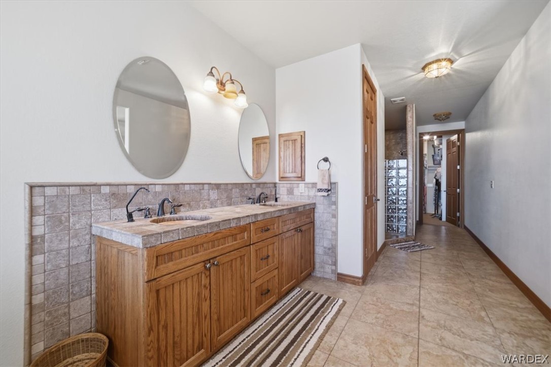 1084 Dike Road Mohave Valley, AZ 86440 - Photo 61 of 75 a bathroom with a double vanity sink and a mirror