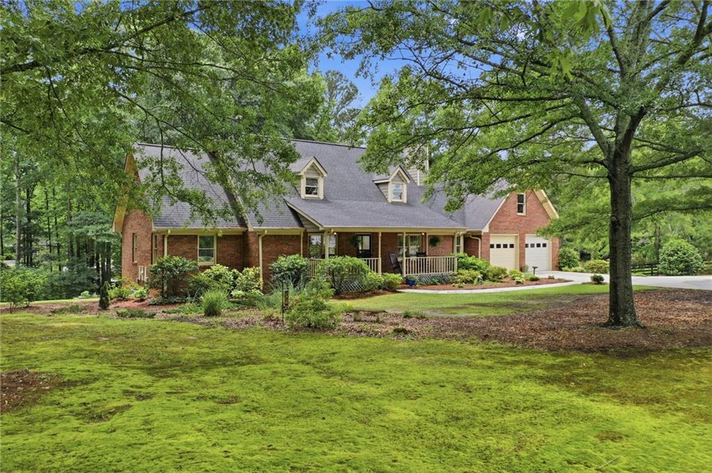 4891 Bill Cheek Road Auburn, GA 30011 - Photo 69 of 99 a front view of a house with a yard