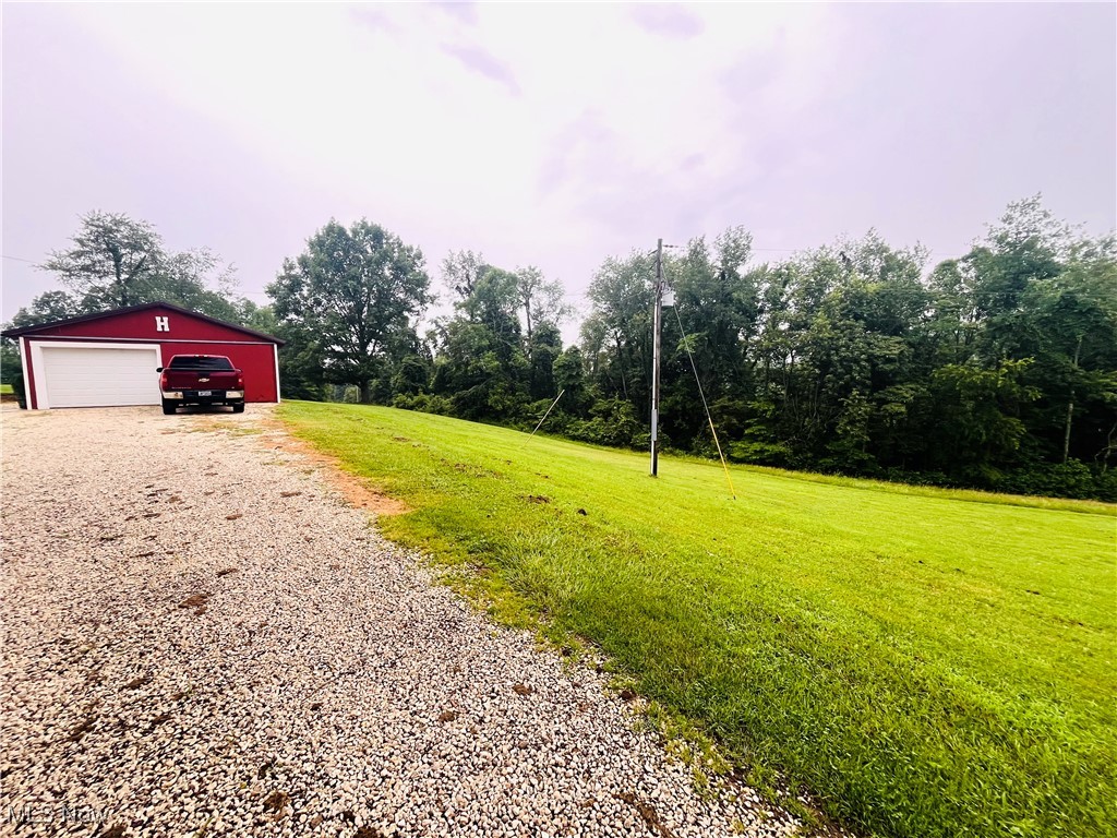 91070 Kilgore Ridge Road Scio, OH 43988 - Photo 36 of 40 View of grassy yard with an outbuilding and a garage
