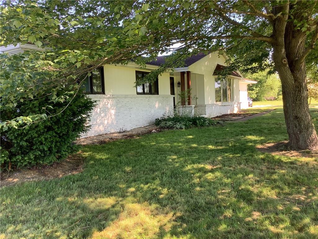 557 Hopper Road Transfer, PA 16154 - Photo 1 of 18 a front view of a house with garden