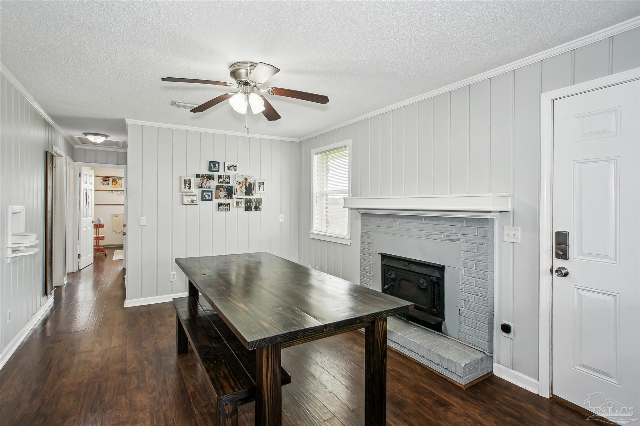 4075 Macks Road Century, FL 32535 - Photo 12 of 35 a view of a livingroom with furniture and a fireplace