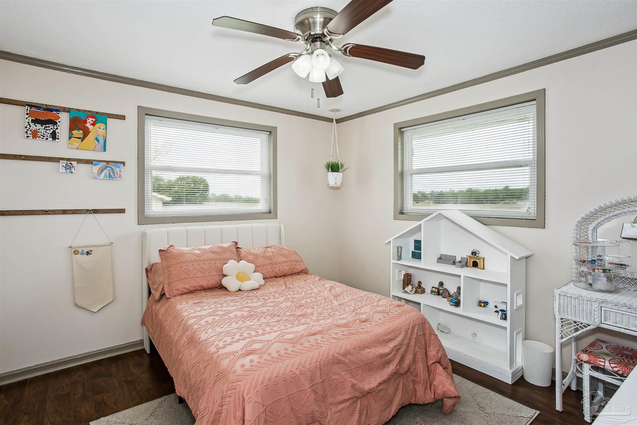 4075 Macks Road Century, FL 32535 - Photo 19 of 35 a bedroom with furniture and a window