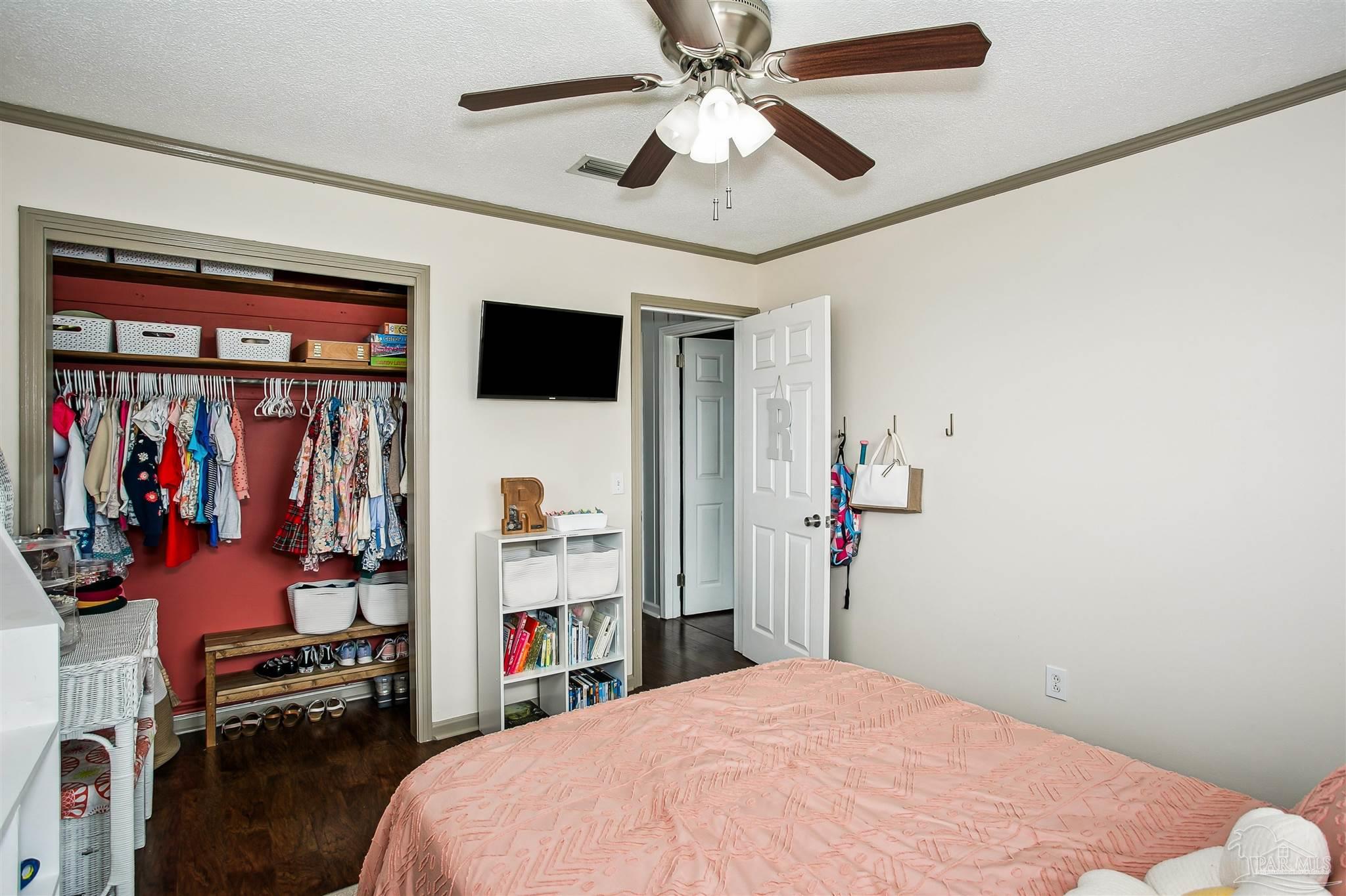 4075 Macks Road Century, FL 32535 - Photo 20 of 35 a bedroom with a bed and a flat screen tv