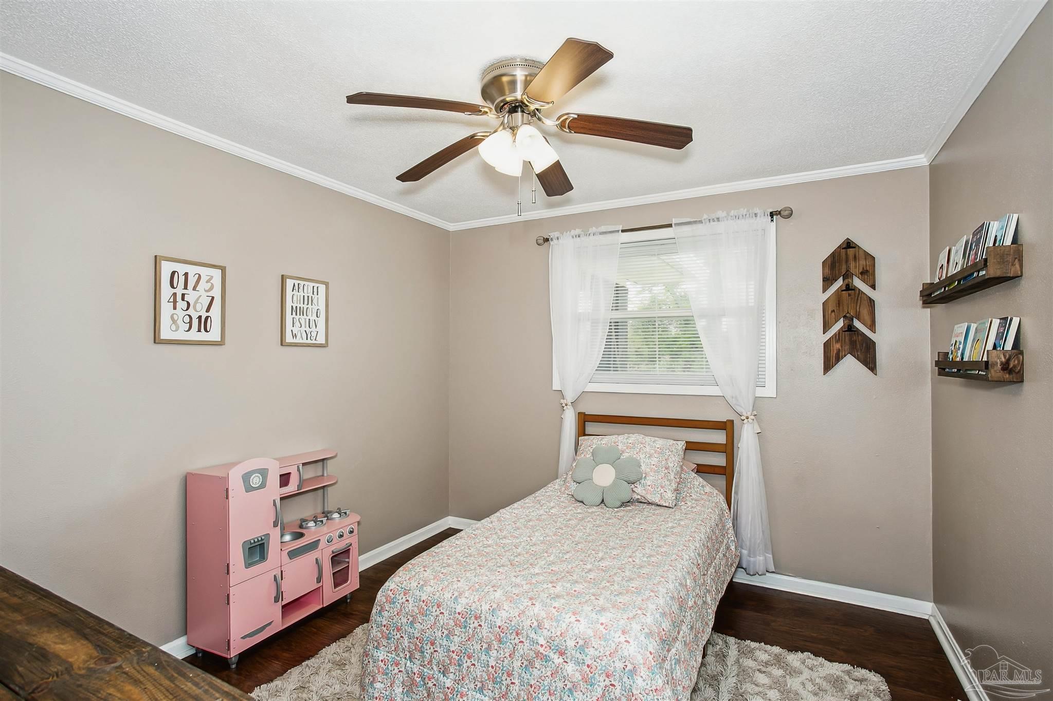 4075 Macks Road Century, FL 32535 - Photo 21 of 35 a bedroom with a bed and a window