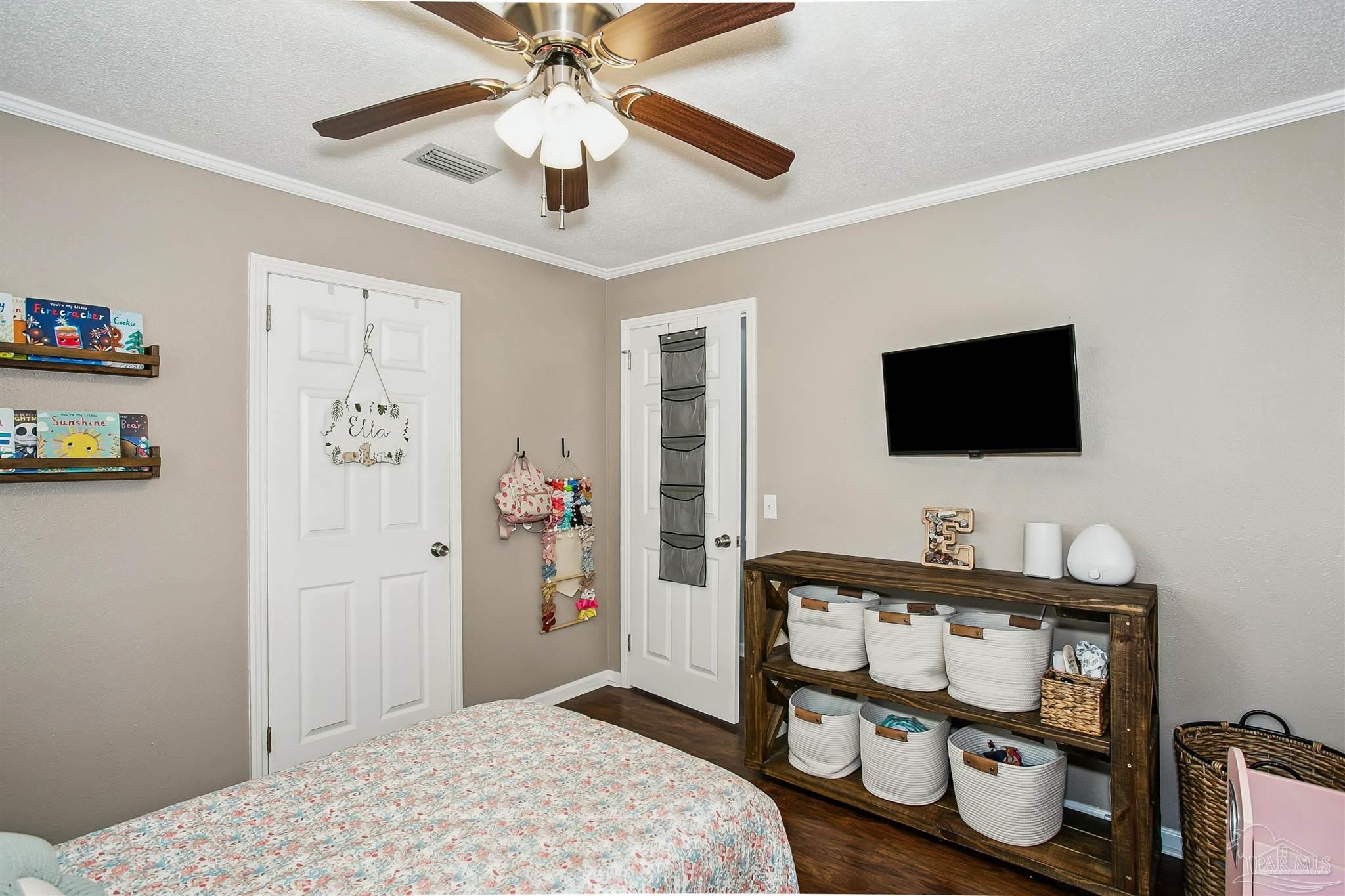 4075 Macks Road Century, FL 32535 - Photo 22 of 35 a bedroom with a bed and a flat screen tv