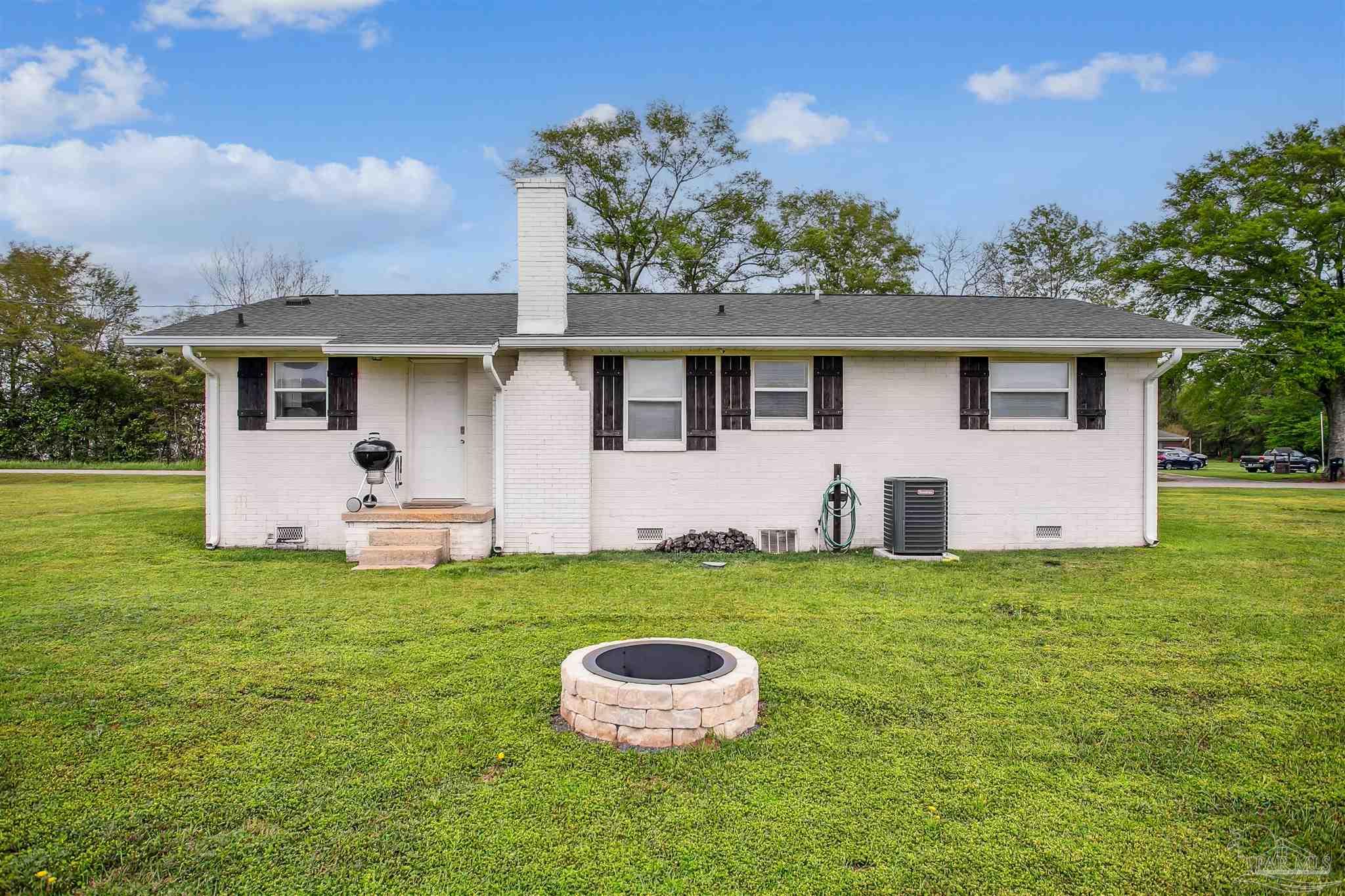 4075 Macks Road Century, FL 32535 - Photo 30 of 35 a house with garden in front of it