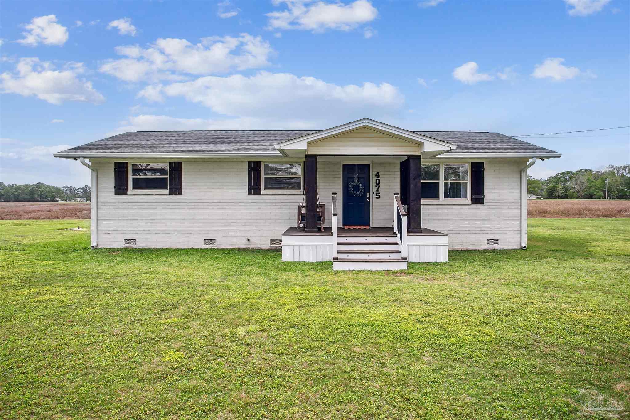 4075 Macks Road Century, FL 32535 - Photo 3 of 35 a front view of house with yard