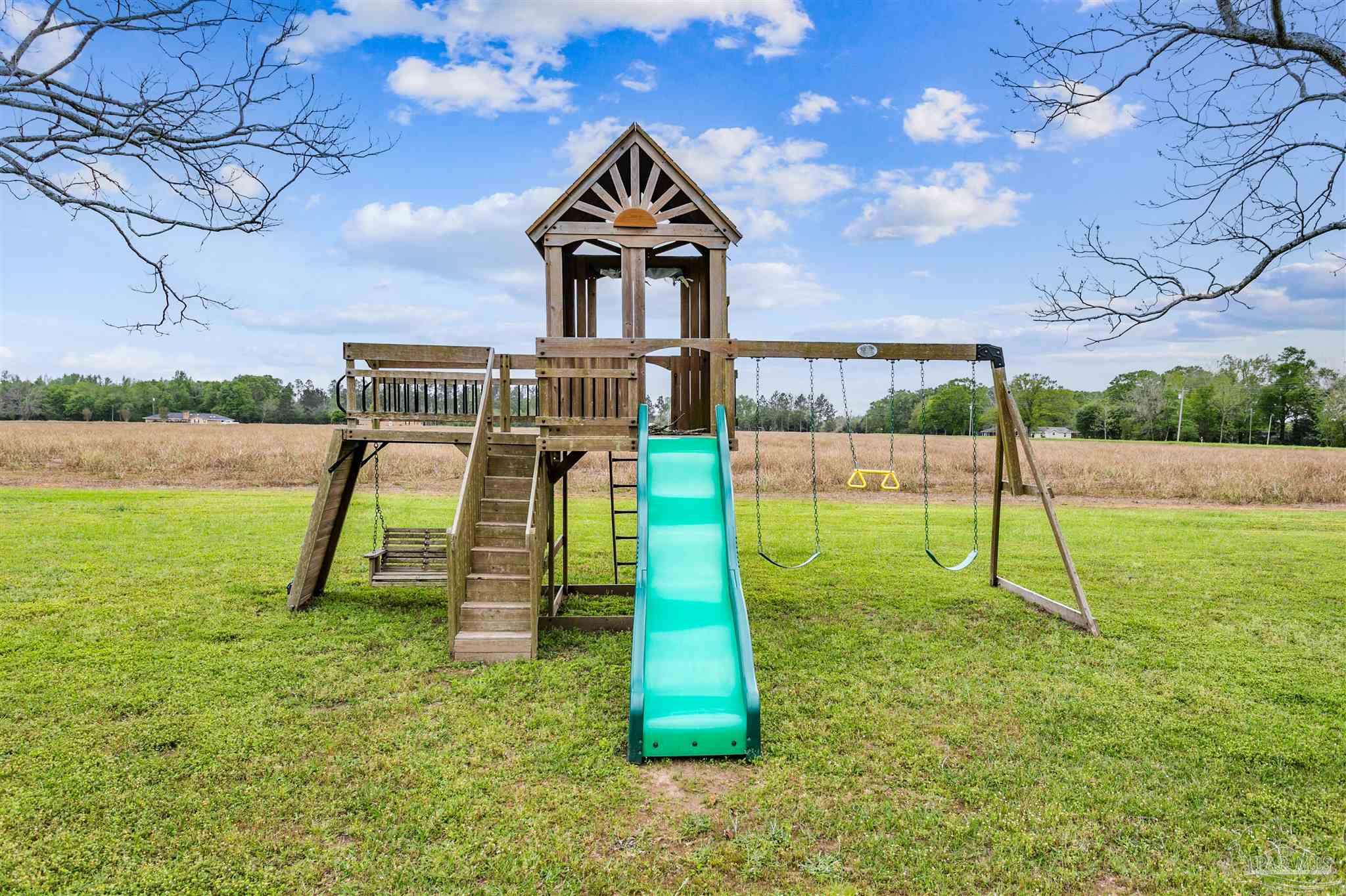 4075 Macks Road Century, FL 32535 - Photo 32 of 35 a view of a park with a slide