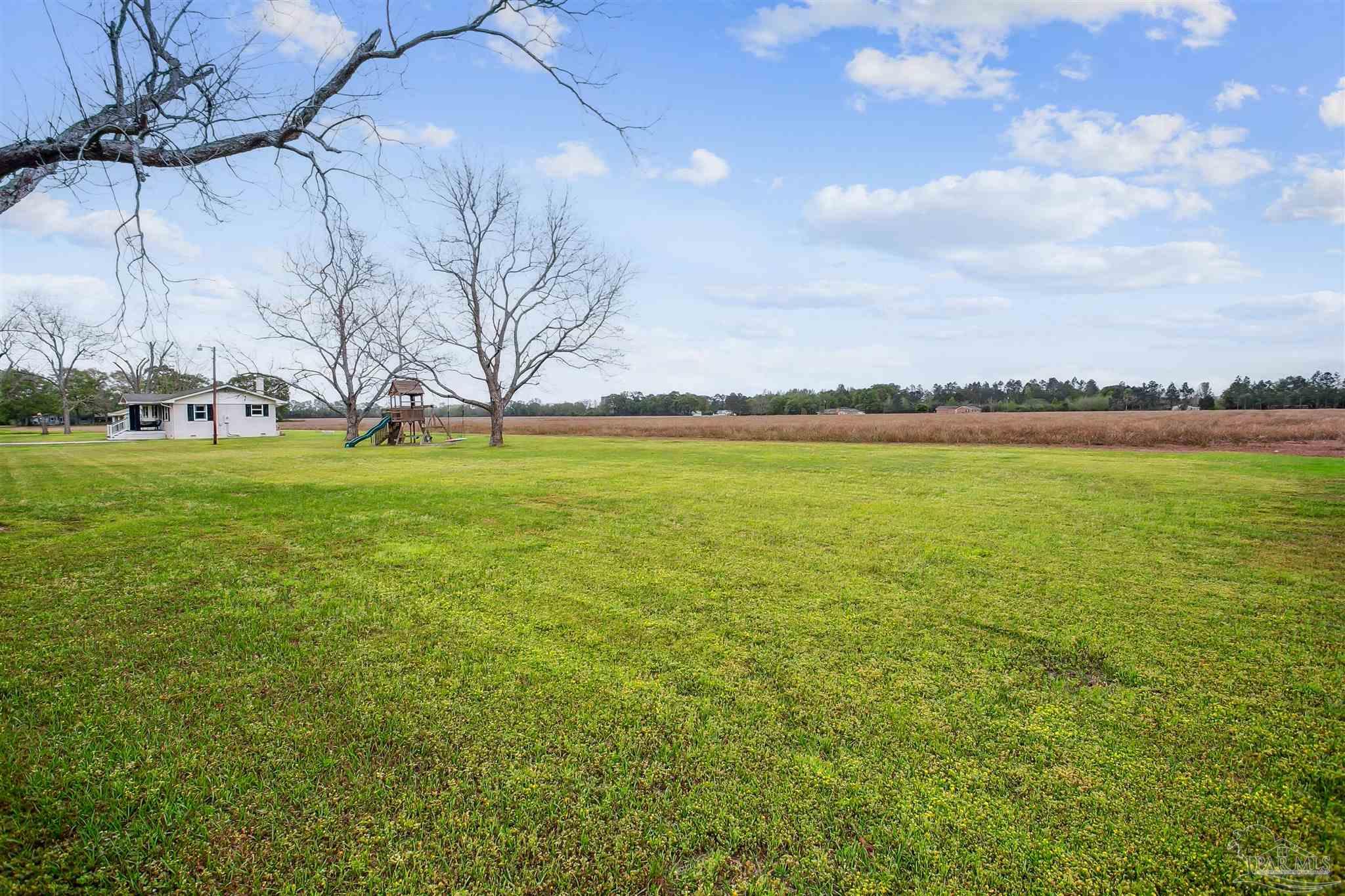 4075 Macks Road Century, FL 32535 - Photo 33 of 35 a view of a ocean with a big yard