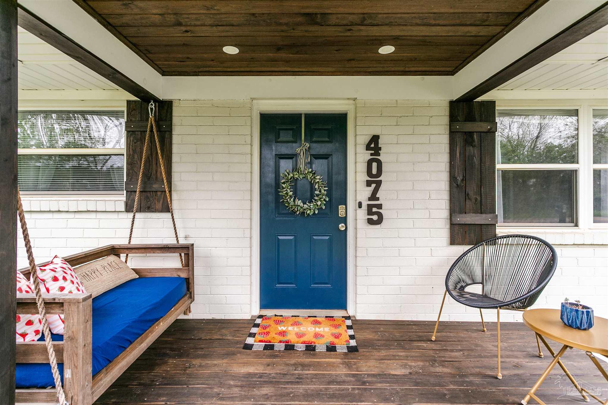 4075 Macks Road Century, FL 32535 - Photo 6 of 35 a bedroom with bed and balcony