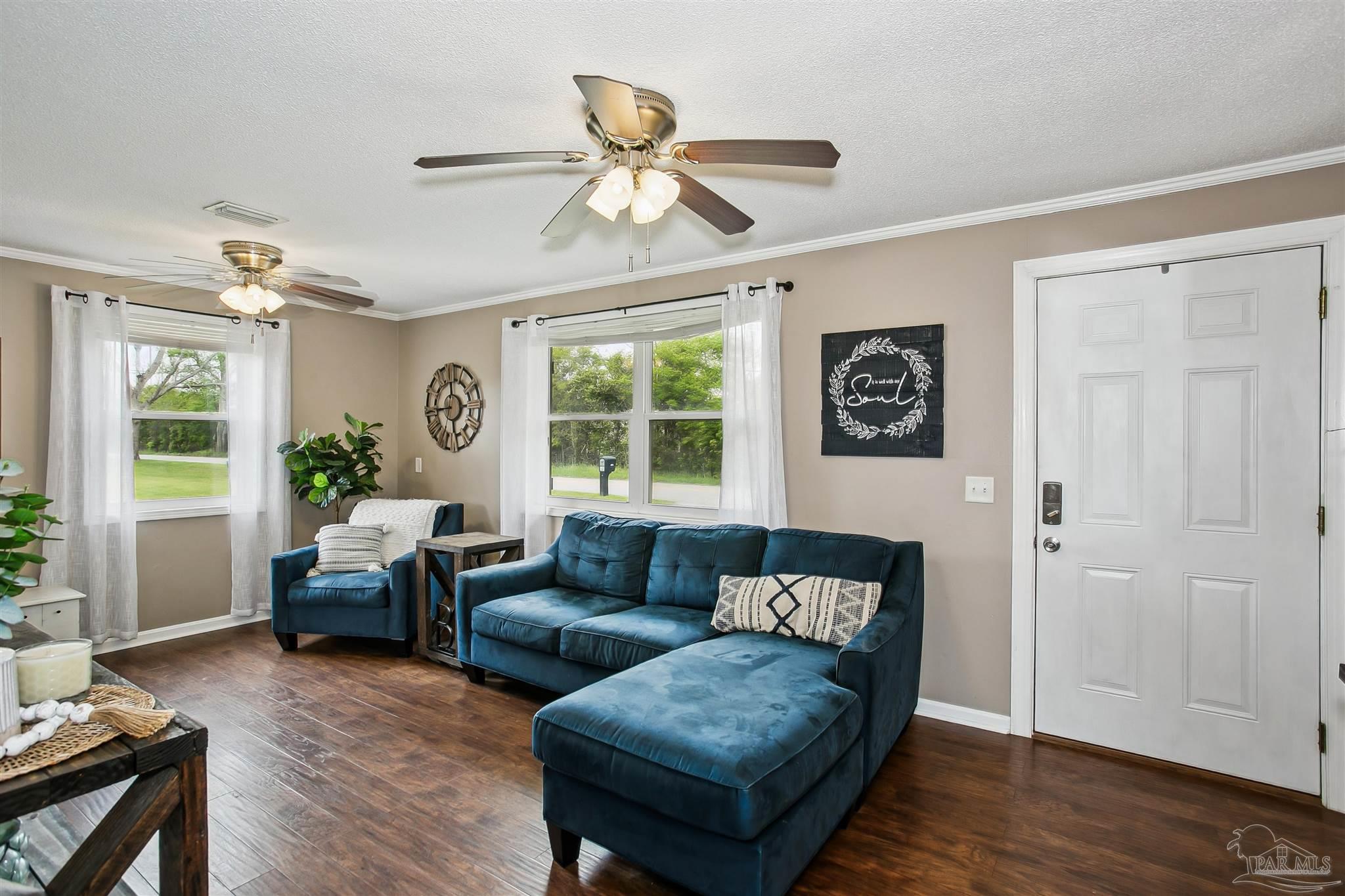 4075 Macks Road Century, FL 32535 - Photo 7 of 35 a living room with furniture and a window