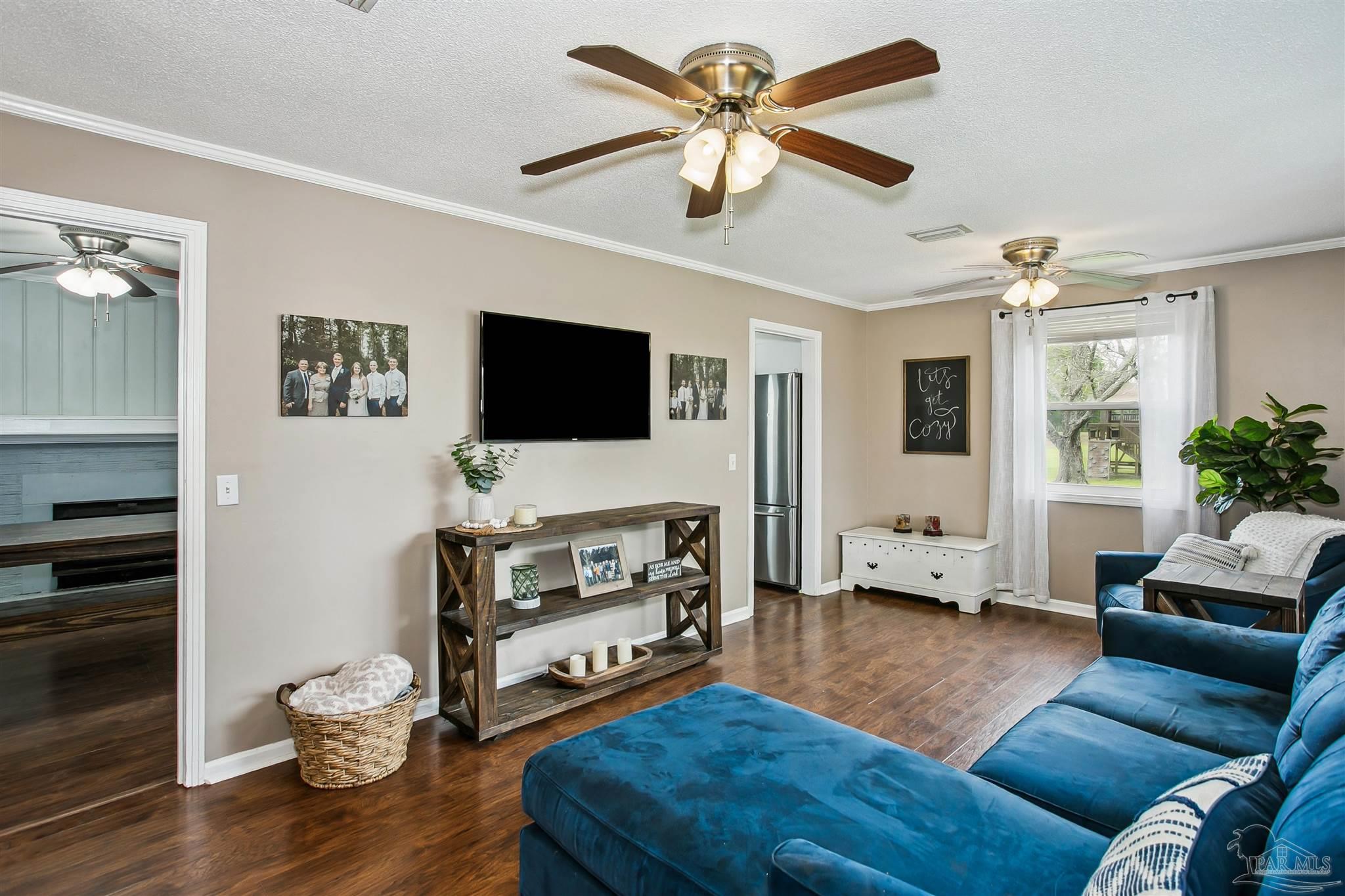 4075 Macks Road Century, FL 32535 - Photo 8 of 35 a living room with furniture and a flat screen tv