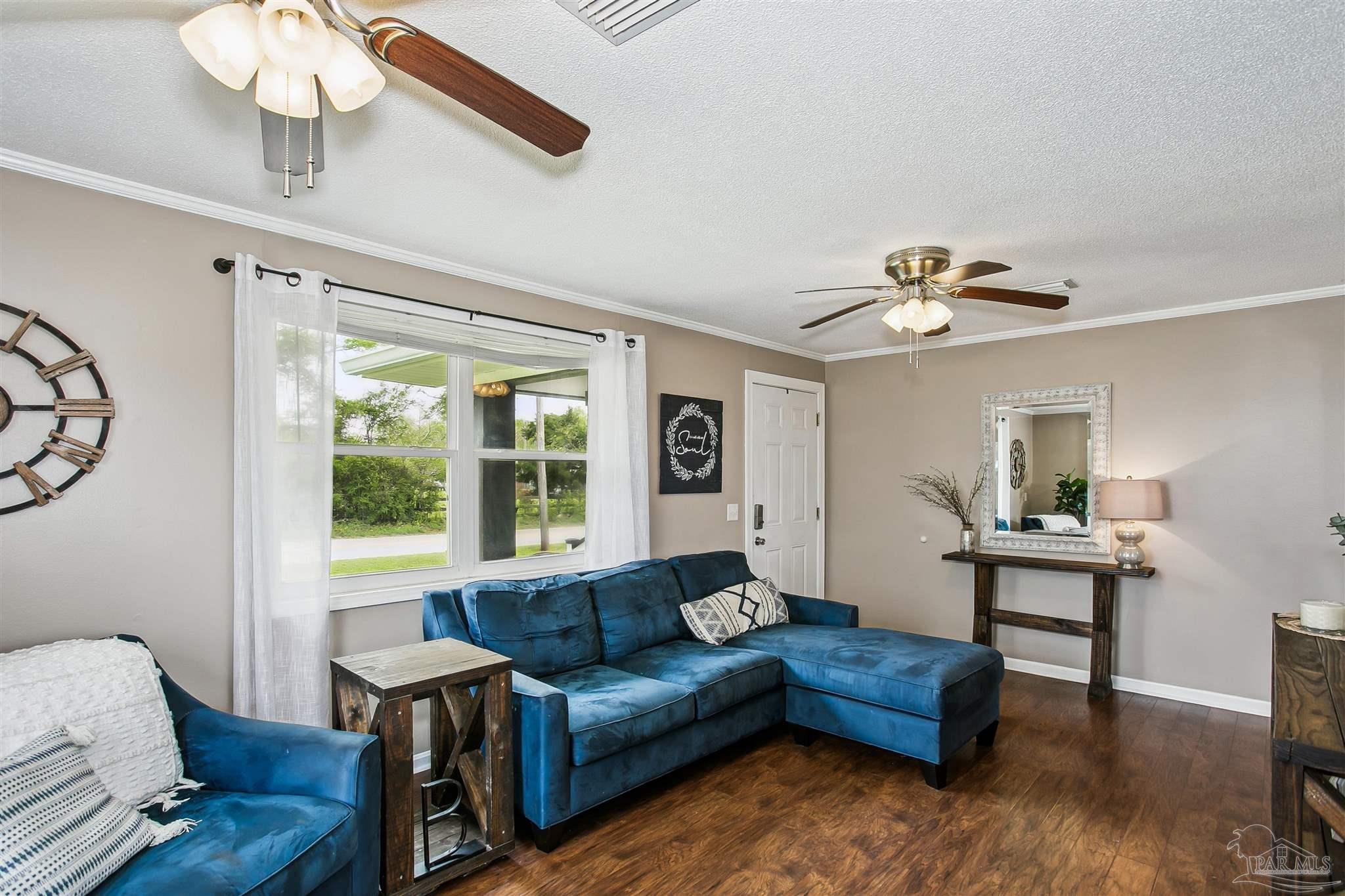 4075 Macks Road Century, FL 32535 - Photo 9 of 35 a living room with furniture and a large window