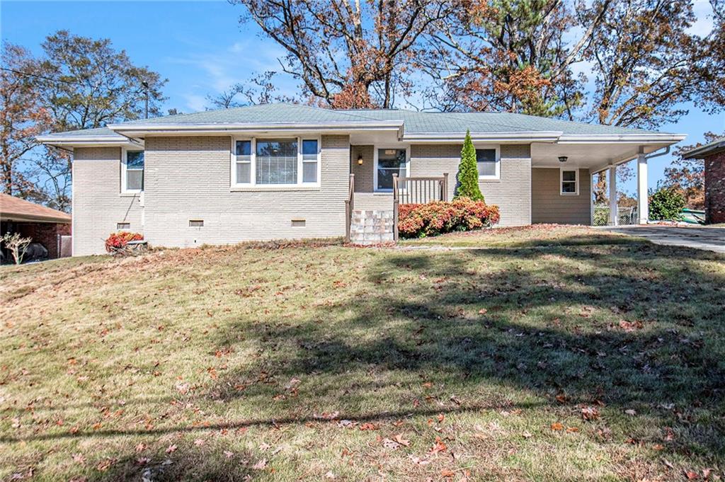 1916 Valencia Road Decatur, GA 30032 - Photo 1 of 1 a view of a house with a yard and large tree