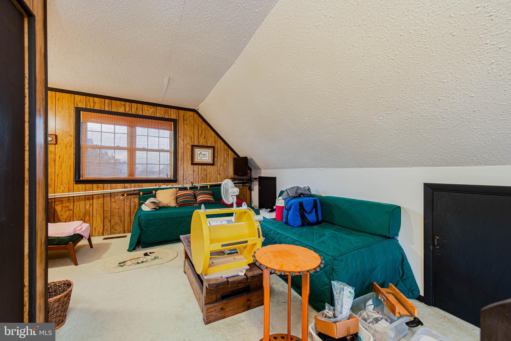 10602 Pine Needle Road Ocean City, MD 21842 - Photo 14 of 36 a living room with furniture and a window