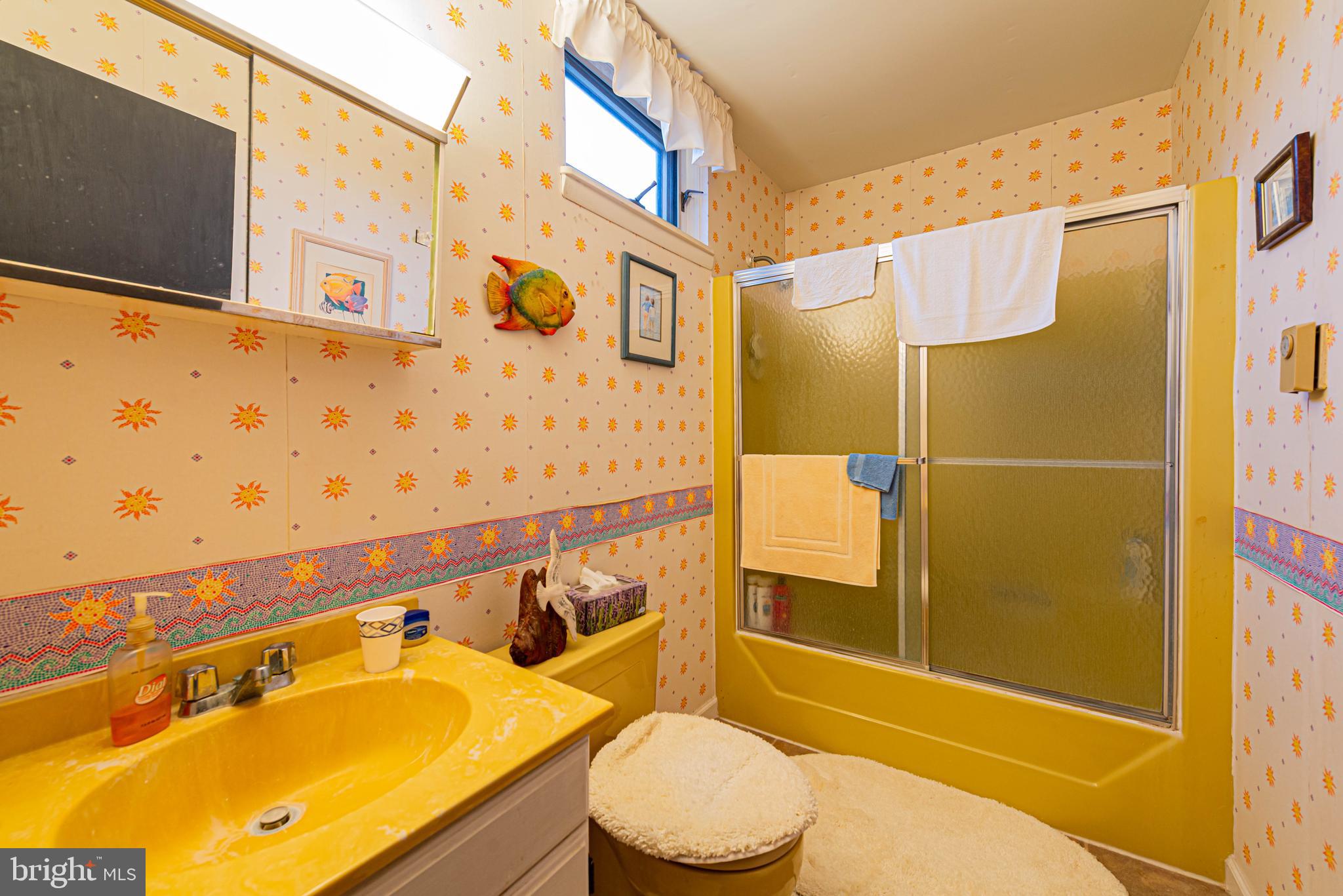 10602 Pine Needle Road Ocean City, MD 21842 - Photo 17 of 36 a bathroom with a sink and a shower
