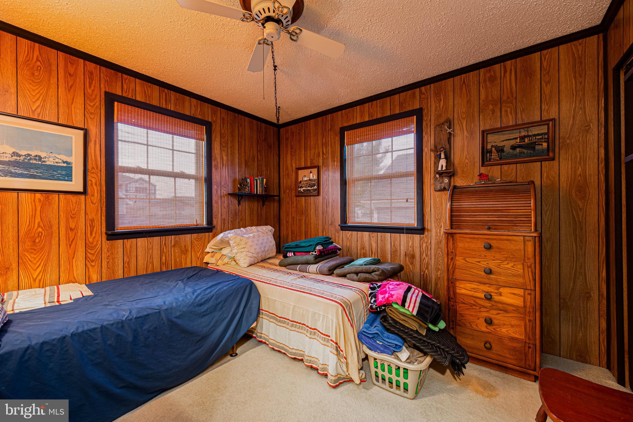 10602 Pine Needle Road Ocean City, MD 21842 - Photo 18 of 36 a bedroom with bed and a window
