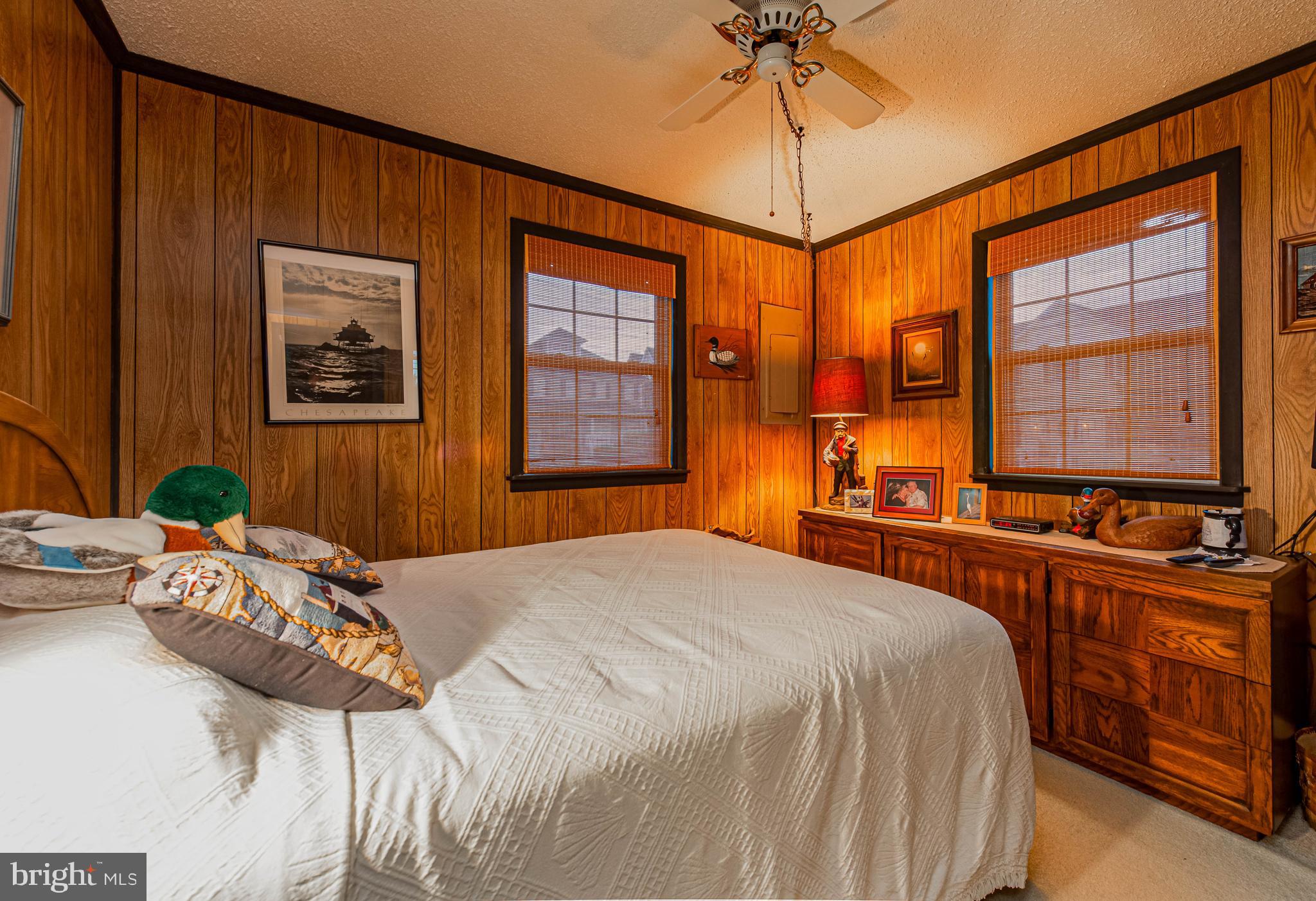 10602 Pine Needle Road Ocean City, MD 21842 - Photo 21 of 36 a bedroom with a bed dresser and a window