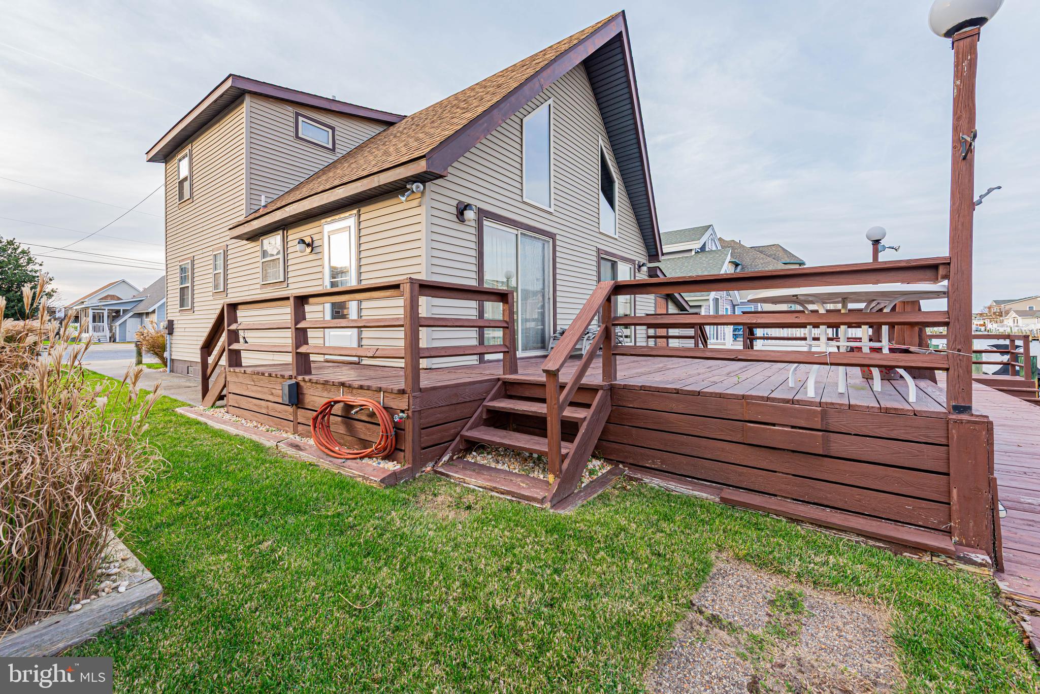 10602 Pine Needle Road Ocean City, MD 21842 - Photo 3 of 36 a view of a house with a yard and sitting area