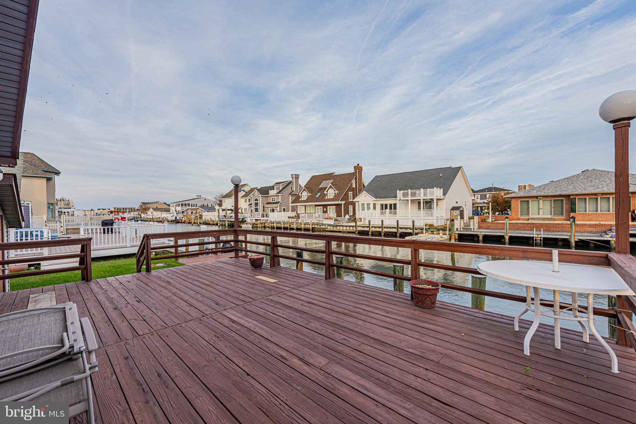 10602 Pine Needle Road Ocean City, MD 21842 - Photo 33 of 36 a view of a rooftop deck with chairs and wooden floor